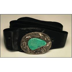 Navajo large sterling silver belt buckle, set with a large irregular turquoise slab in a serrat...