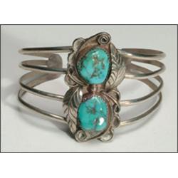 2 Navajo silver open bangles, the first formed as an ingot band set with 3 oval turquoise caboc...
