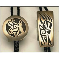 2 Hopi sterling silver and leather bolo ties, both with deeply incised and oxidized decoration...