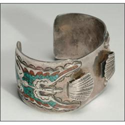 2 Navajo sterling silver watch bands, the first formed as a flat cuff and decorated with inlaid...