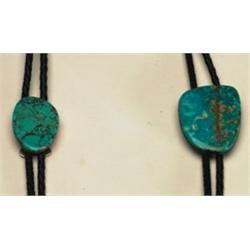 2 Navajo silver, stone and leather bolo ties, each simply formed as stabilized turquoise slabs...