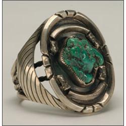 Navajo sterling silver open bangle, formed 2 ingot and 2 twisted bands flaring and set with a t...