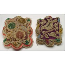 Two Woodland miniature cushions, each decorated with clear and coloured floral beadwork, 10" - 25...