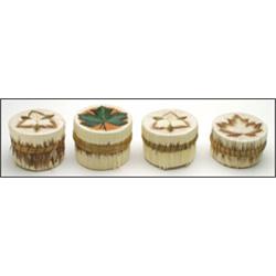 A group of four Woodland circular lidded birch bark boxes, each decorated with colourful quillwor...