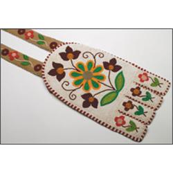A Woodland hide Necessary Bag, decorated with floral beadwork on a white ground, 33" - 83.8 cm....