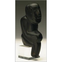 A Woodland (possibly) stone pipehead, carved as a seated figure, 6.3" - 15.9 cm., See illustrat...