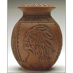 TURTLE SINGER,, A Six-Nations ceramic vase with all over carved decoration and a brown glaze, s...