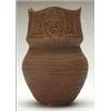 Image 1 : TALKING EARTH,, GUARDIAN SPIRIT,, A Six Nations ceramic vase with all over carved decoration...