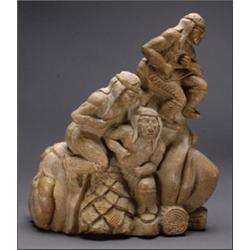GARFIELD THOMAS, A stone carving of a group of native figures dancing with the moon, the moon w...