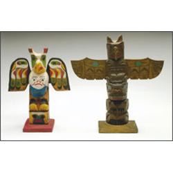 D. ISAAK, A Northwest Coast carved and painted wood miniature totem pole, together with a simil...