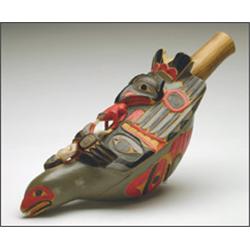 A Northwest Coast wood ceremonial rattle, carved and painted as a bird surmounted with a shaman,...