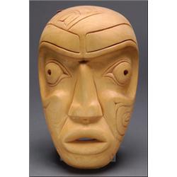 ROCKY JONES (1949 - ), A Northwest Coast carved wood human face mask, signed and dated '80,11.5...