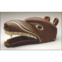 LES NELSON, A Northwest Coast carved and painted wood Land Otter mask, with a hinged jaw, signe...