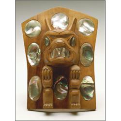 A Northwest Coast carved wood Khut-Whee-Mul-Uch (bear), frontlet with inset abalone shell, titled...