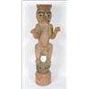 Image 1 : A Northwest Coast carved wood ancestor figure with extended arms, crouching on a frog, with weath...