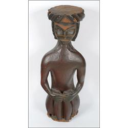 A Northwest Coast (possibly 'Nuu-Chah-Nulth' Nootka) carved wood Potlatch figure, the crouching f...