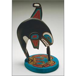 RUTH BAKER, A Northwest Coast carved and painted wood killer whale and seal on a two headed ser...
