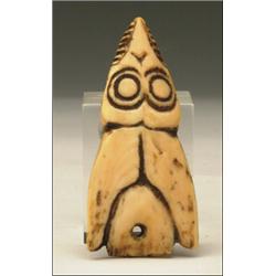 A Northwest Coast Tlingit carved ivory bird pendant, 3.5" - 8.9 cm., See illustration, Est. $...
