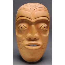 ROCKY JONES (1949 - ), A Northwest Coast carved wood face mask, with incised decoration, signed...