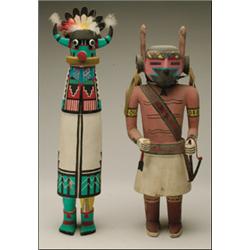 TWO HOPI POLYCHROME WOOD KACHINA DOLLS, one figure with elaborately painted embroidery, the face...