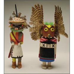 A HOPI POLYCHROME WOOD KACHINA DOLLS, one figure wearing a casemask decorated with feathers, toge...