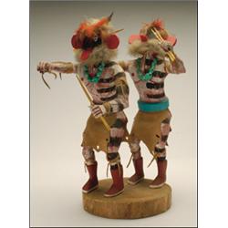 TWO HOPI POLYCHROME WOOD KACHINA DOLLS,, mounted to one base, the figures each wearing a hide k...