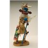 Image 1 : A HOPI POLYCHROME WOOD KACHINA DOLL, representing the Cow Kachina, the figure wearing a hide kilt...