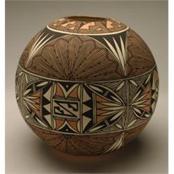 ACOMA POLYCHROME JAR, painted over the burnished cream slip in black with an elaborate pattern of...