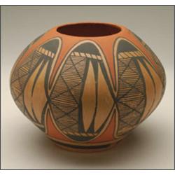 A HOPI POLYCHROME SEED JAR, with flaring body and compressed shoulder, finely painted over an ear...