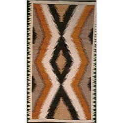 A NAVAJO RUG, mid 20th Century, a repeating stepped lozenge pattern in ivory, black, grey and bei...