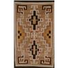Image 1 : NAVAJO RUG, mid 20th Century, two latch-hook medallions in white, brown and red on a tan field...