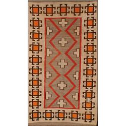 NAVAJO RUG, early 20 Century charcoal grey field with flowerheads and stepped serrated bands in w...