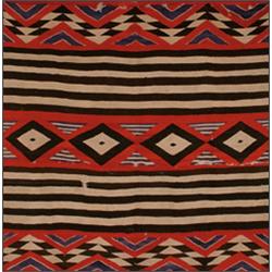 A NAVAJO RUG, early 20th Century, woven in red, black, ivory and blue, a centre polychrome band o...