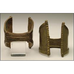 Pair of Brass Anklets, the twin triangle flanges rising from rope twist shanks, w. 3.5" - 9 cm....