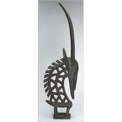 Bambara Chiwara, of Minianka type, the single figure with boldly pierced neck and mane, the lon...