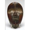 Image 1 : Dan Mother Mask, the ovoid face with sunken eyes encircled with traces of white pigment, the ey...