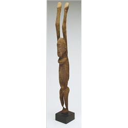 Dogon Standing Tellem Figure of a Woman, with long broad shouldered body, the long face with fl...
