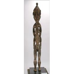 Sepik River Wood Figure of a Woman, near life size, the deeply carved ovoid face trimmed with f...