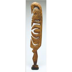 Sepik Figure of a Woman, in profile showing multiple hook forms, the head with bulging forehead...