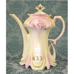 Unmarked draped chocolate pot.