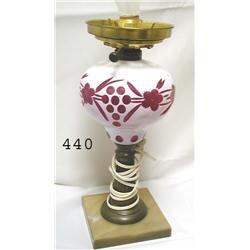 White cut to cranberry table lamp.