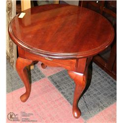 ROUND CHERRY COLOR END TABLE.