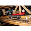Image 2 : SHELF OF OUTDOOR ITEMS INCLUDING SKIIS, GOLF PUTTERS, PICNIC BASKETS, AND MORE