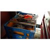 Image 1 : TOTE W/ CORDLESS SKIL SAW AND HARDHAT