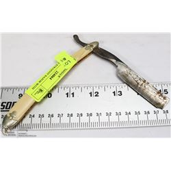 VINTAGE STRAIGHT RAZOR WITH WHITE HANDLE.