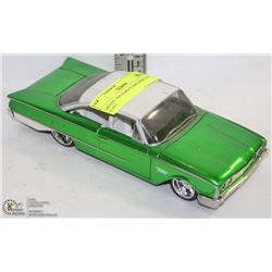 GREEN 1960 FORD STARLINER DIE CAST.