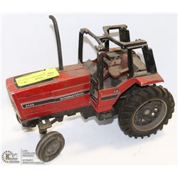VINTAGE INTERNATIONAL TRACTOR METAL TOY.