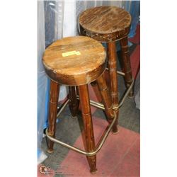A PAIR OF VINTAGE SOLID WOOD BAR STOOLS