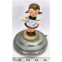 1950'S SPINNING SINGING GIRL MUSICAL TOY