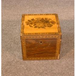 Une boîte à thé en palissandre et bois satiné d'époque Regency, vers 1820, le couvercle orné d'un...